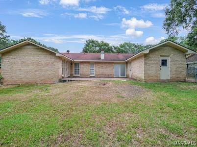1243 Highpoint Rd, Montgomery, AL 36109 - rear view of property with a yard