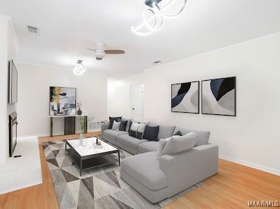 1243 Highpoint Rd, Montgomery, AL 36109 - living room featuring light wood-style floors and a ceiling fan