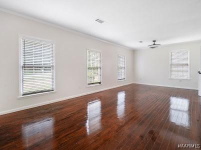 1243 Highpoint Rd, Montgomery, AL 36109 - unfurnished room featuring ornamental molding, healthy amount of natural light, and hardwood / wood-style floors