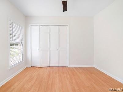 1243 Highpoint Rd, Montgomery, AL 36109 - unfurnished bedroom featuring light wood-style floors and a closet