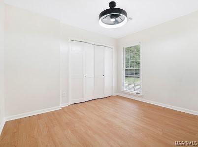 1243 Highpoint Rd, Montgomery, AL 36109 - unfurnished bedroom with light wood-style floors and a closet
