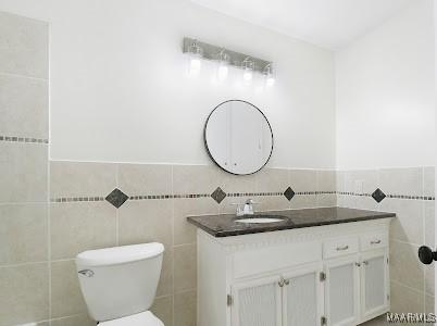 1243 Highpoint Rd, Montgomery, AL 36109 - bathroom with tile walls and vanity