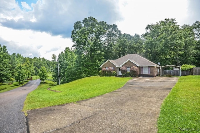 134 Taylor Hill Dr, Wetumpka, AL 36092 - ranch-style home with a detached carport, driveway, and brick siding