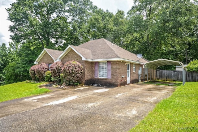 134 Taylor Hill Dr, Wetumpka, AL 36092 - single story home featuring a detached carport, brick siding, and concrete driveway