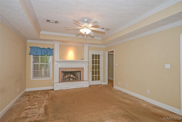 134 Taylor Hill Dr, Wetumpka, AL 36092 - unfurnished living room featuring a raised ceiling, ceiling fan, a fireplace, carpet flooring, and crown molding