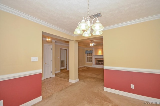 134 Taylor Hill Dr, Wetumpka, AL 36092 - unfurnished room with a chandelier, light carpet, crown molding, a fireplace with raised hearth, and ceiling fan