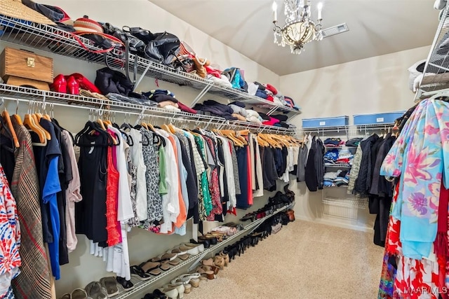 9185 Brenham Ct, Montgomery, AL 36117 - walk in closet with carpet flooring and a chandelier