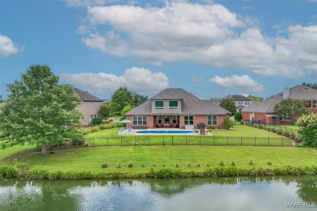 9185 Brenham Ct, Montgomery, AL 36117 - back of property featuring a fenced backyard, a water view, brick siding, and a patio area