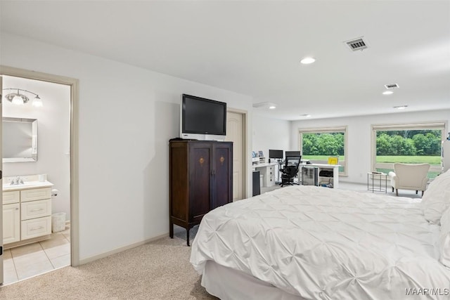 9185 Brenham Ct, Montgomery, AL 36117 - bedroom with recessed lighting, a desk, ensuite bath, light tile patterned floors, and light carpet