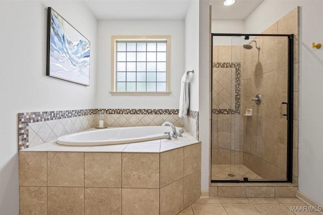 9185 Brenham Ct, Montgomery, AL 36117 - full bath featuring a bath, a shower stall, and tile patterned flooring