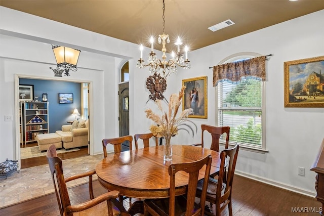9185 Brenham Ct, Montgomery, AL 36117 - dining space with a chandelier and wood-type flooring