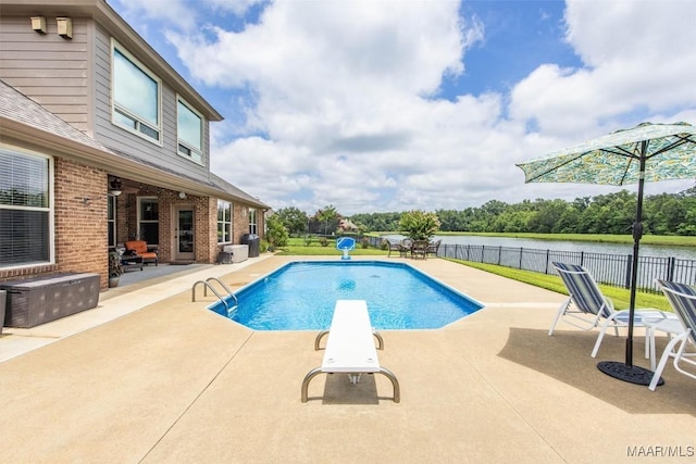 9185 Brenham Ct, Montgomery, AL 36117 - view of swimming pool with a patio area, a water view, and a diving board