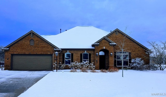 9185 Brenham Ct, Montgomery, AL 36117 - view of front of property featuring an attached garage, brick siding, and driveway