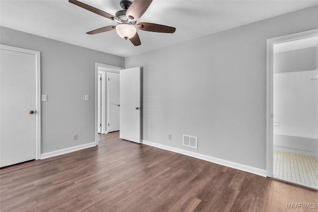 3213 Milan Dr, Montgomery, AL 36109 - unfurnished bedroom with wood finished floors, ensuite bath, and a ceiling fan