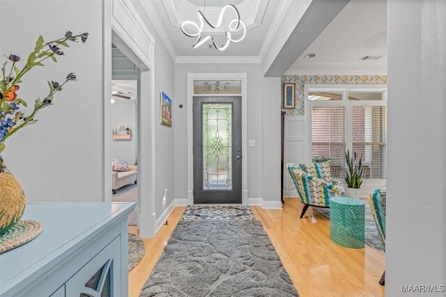 378 Winding Wood Dr, Wetumpka, AL 36093 - entryway featuring ornamental molding, a chandelier, and light wood finished floors