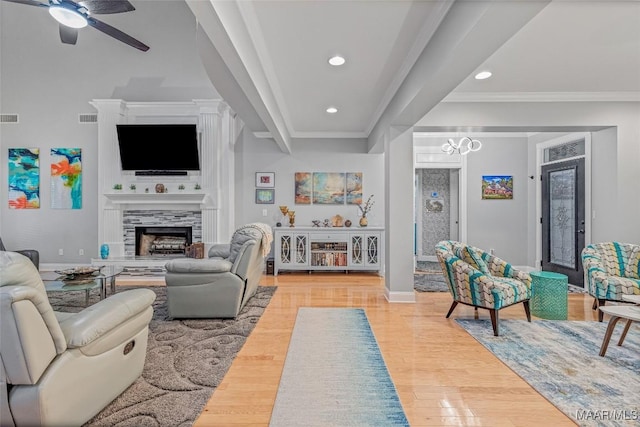 378 Winding Wood Dr, Wetumpka, AL 36093 - living area with a ceiling fan, wood finished floors, recessed lighting, a tiled fireplace, and ornamental molding