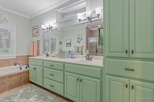 378 Winding Wood Dr, Wetumpka, AL 36093 - full bathroom featuring a chandelier, double vanity, a stall shower, a bath, and ornamental molding