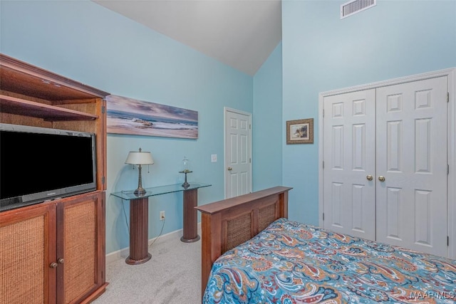 378 Winding Wood Dr, Wetumpka, AL 36093 - bedroom with light colored carpet, a closet, and lofted ceiling