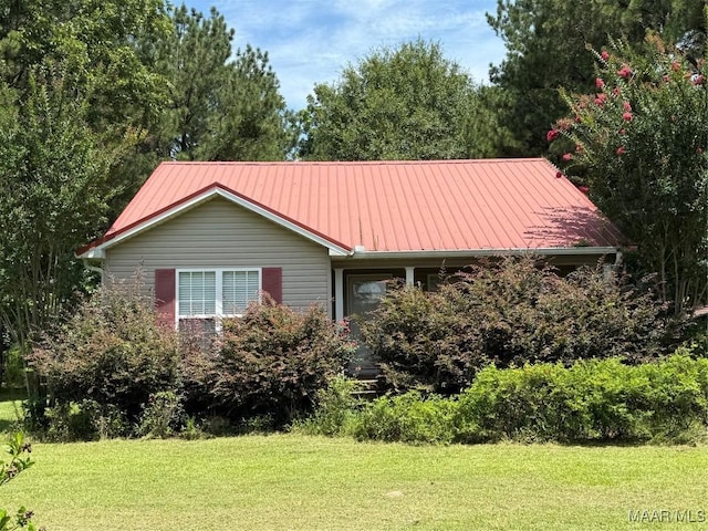 190 County Road 420, Tyler, AL 36785 - view of front of home with a front lawn and a metal roof