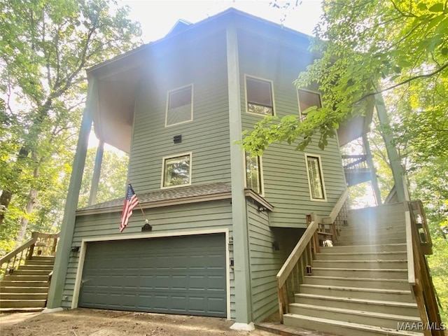 400 Millcreek Rd, Wetumpka, AL 36093 - view of side of home with stairway, an attached garage, and driveway