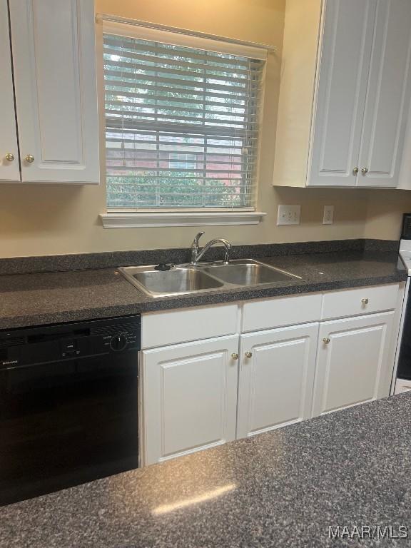 9324 Bristlecone Dr, Montgomery, AL 36117 - kitchen featuring dishwasher, dark countertops, and white cabinets