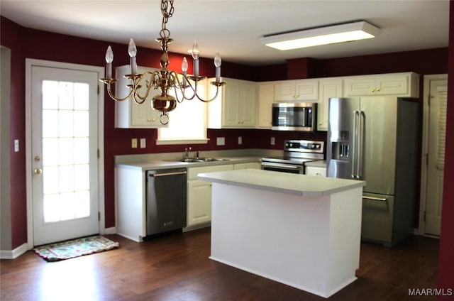 2108 Halcyon Downs Loop, Montgomery, AL 36117 - kitchen with stainless steel appliances, light countertops, a chandelier, white cabinets, and dark wood finished floors