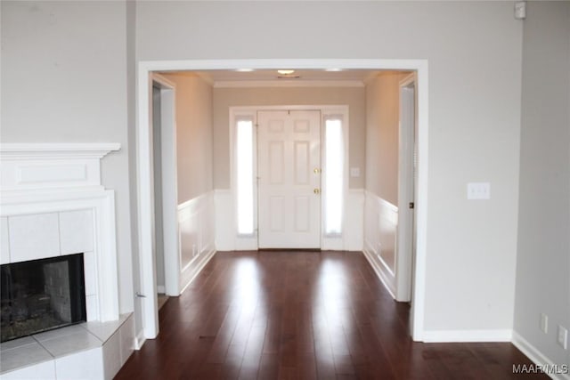 2108 Halcyon Downs Loop, Montgomery, AL 36117 - entrance foyer with dark wood-type flooring, ornamental molding, wainscoting, and a tile fireplace
