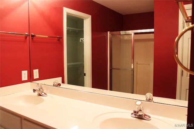 2108 Halcyon Downs Loop, Montgomery, AL 36117 - full bathroom featuring a shower stall, double vanity, and a spacious closet