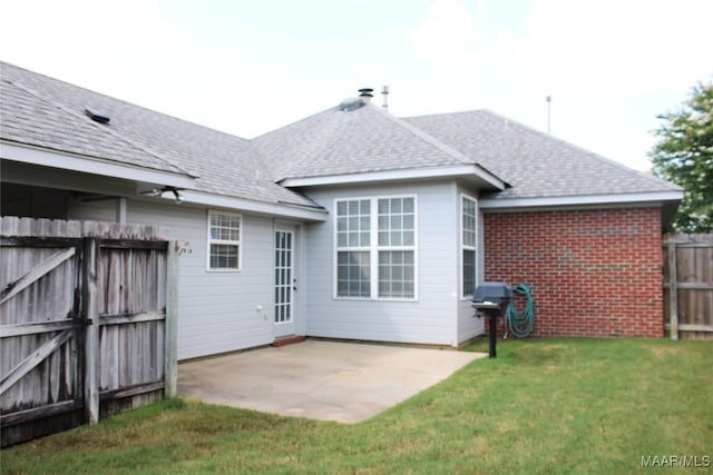 2108 Halcyon Downs Loop, Montgomery, AL 36117 - back of property with a shingled roof, a patio, and a gate