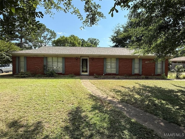 203 Marian Dr, Prattville, AL 36067 - ranch-style house with brick siding and a front yard