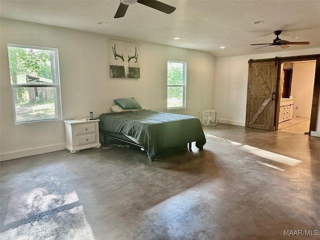 174 Weldon Rd, Tallassee, AL 36078 - bedroom with a barn door, finished concrete flooring, multiple windows, recessed lighting, and a ceiling fan