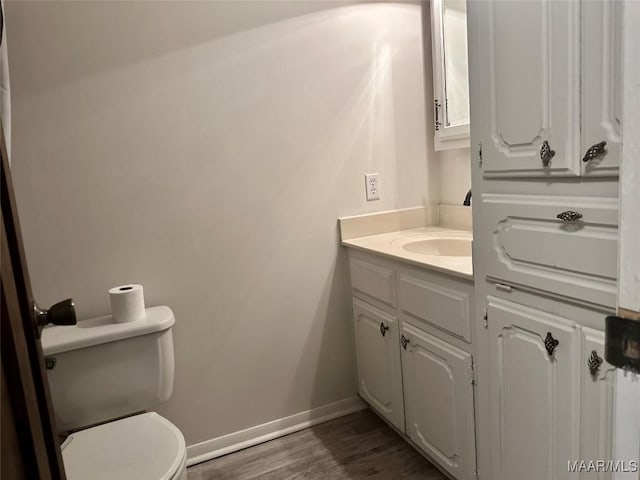 174 Weldon Rd, Tallassee, AL 36078 - half bathroom featuring vanity and wood finished floors