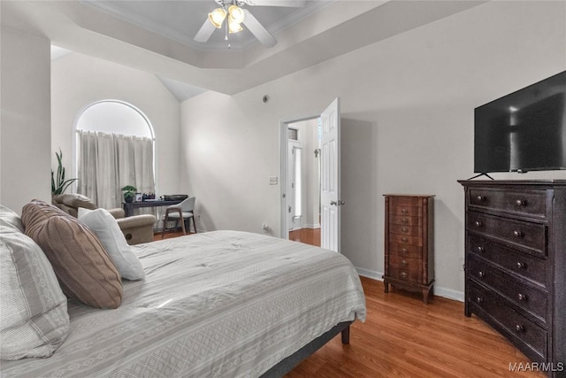 6779 Overview Dr, Montgomery, AL 36117 - bedroom featuring wood finished floors, a tray ceiling, ceiling fan, and ornamental molding