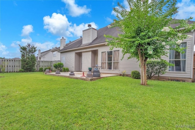 6779 Overview Dr, Montgomery, AL 36117 - rear view of house with a patio and a chimney