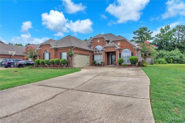 6779 Overview Dr, Montgomery, AL 36117 - traditional-style home with brick siding, a front lawn, and driveway