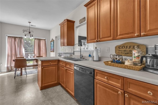 6779 Overview Dr, Montgomery, AL 36117 - kitchen with dishwasher, light countertops, brown cabinets, decorative light fixtures, and a peninsula