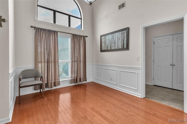 6779 Overview Dr, Montgomery, AL 36117 - foyer with healthy amount of natural light, wainscoting, light wood-style floors, and a decorative wall