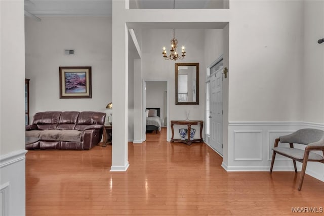 6779 Overview Dr, Montgomery, AL 36117 - entryway featuring a chandelier, wood finished floors, and a wainscoted wall