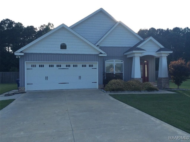 101 Regans Way S, Deatsville, AL 36022 - view of front of property with driveway, a garage, board and batten siding, and a front yard