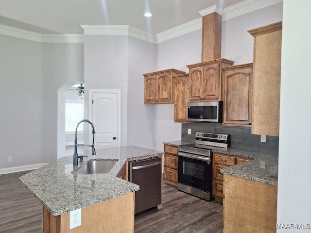 101 Regans Way S, Deatsville, AL 36022 - kitchen with stainless steel appliances, a kitchen island with sink, dark wood-style flooring, light stone counters, and crown molding