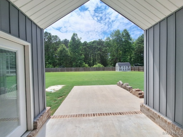 101 Regans Way S, Deatsville, AL 36022 - fenced backyard featuring a patio area and a storage unit