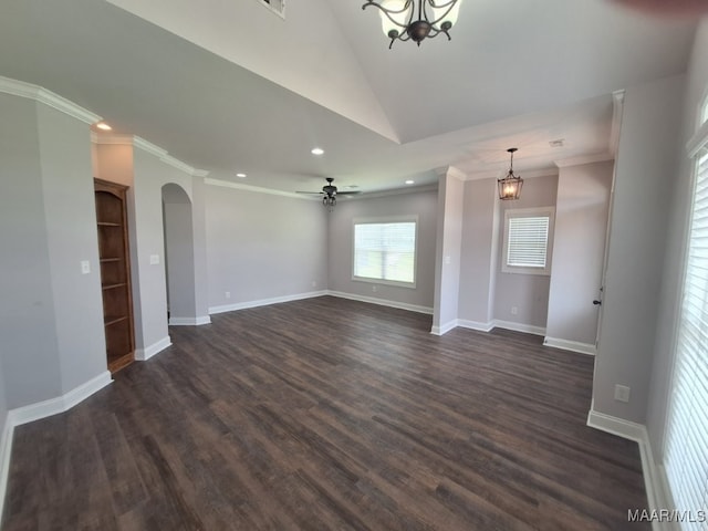 101 Regans Way S, Deatsville, AL 36022 - unfurnished living room featuring vaulted ceiling, arched walkways, a chandelier, recessed lighting, and dark wood-style floors