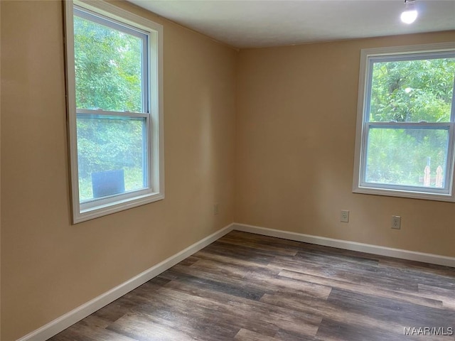 1010 New St, Tuskegee, AL 36083 - unfurnished room featuring wood finished floors and baseboards