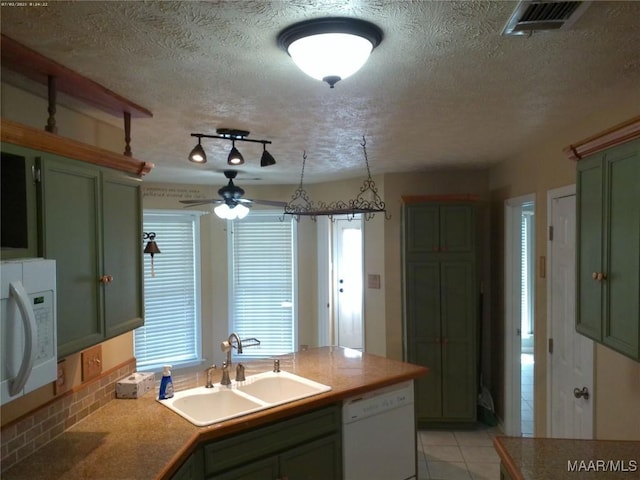 213 Foxdale Rd, Millbrook, AL 36054 - kitchen featuring green cabinetry, white dishwasher, a textured ceiling, a ceiling fan, and light tile patterned floors