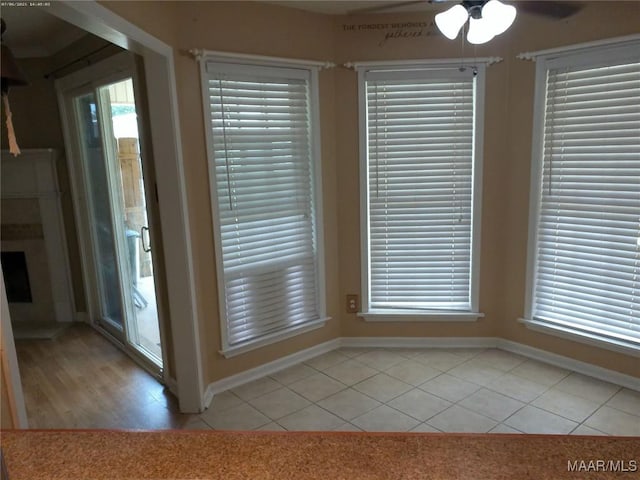 213 Foxdale Rd, Millbrook, AL 36054 - unfurnished dining area featuring light tile patterned floors and a ceiling fan