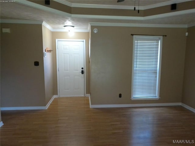 213 Foxdale Rd, Millbrook, AL 36054 - foyer featuring wood finished floors, a tray ceiling, ceiling fan, and ornamental molding