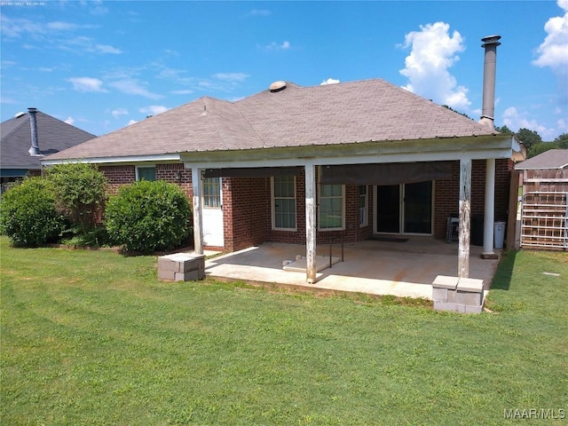 213 Foxdale Rd, Millbrook, AL 36054 - back of house featuring brick siding, a patio area, and a yard