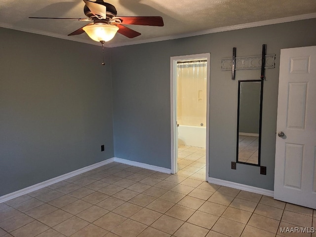 213 Foxdale Rd, Millbrook, AL 36054 - empty room featuring ceiling fan, ornamental molding, light tile patterned flooring, and a textured ceiling