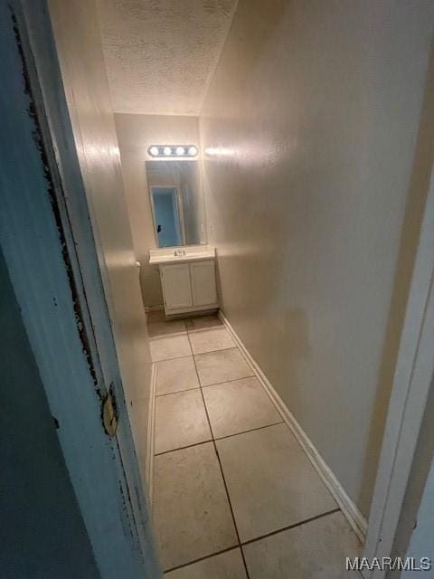 3440 Wickham Rd, Montgomery, AL 36116 - bathroom with tile patterned floors, vanity, and a textured ceiling