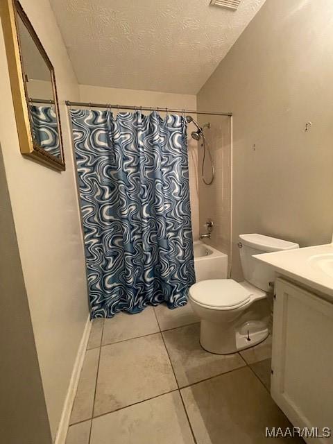 3440 Wickham Rd, Montgomery, AL 36116 - full bathroom featuring tile patterned flooring, a textured ceiling, vanity, and shower / tub combo with curtain